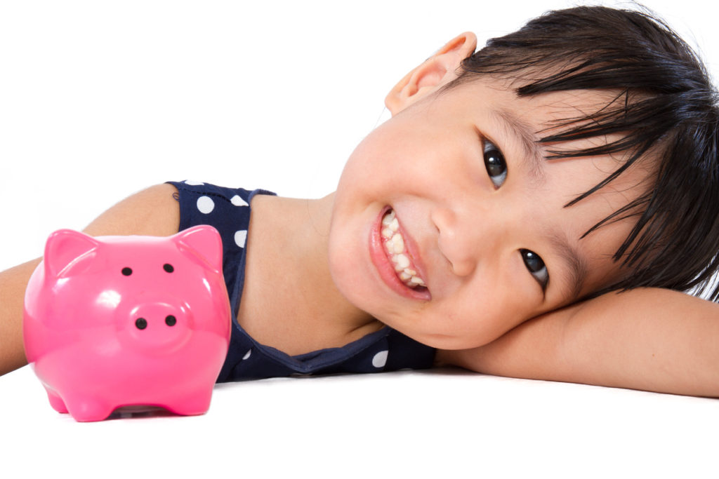 Little Girl With Piggy Bank
