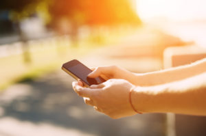 Close up of a man using mobile smartphone soft focus, video calls, holidays to work, using the Internet