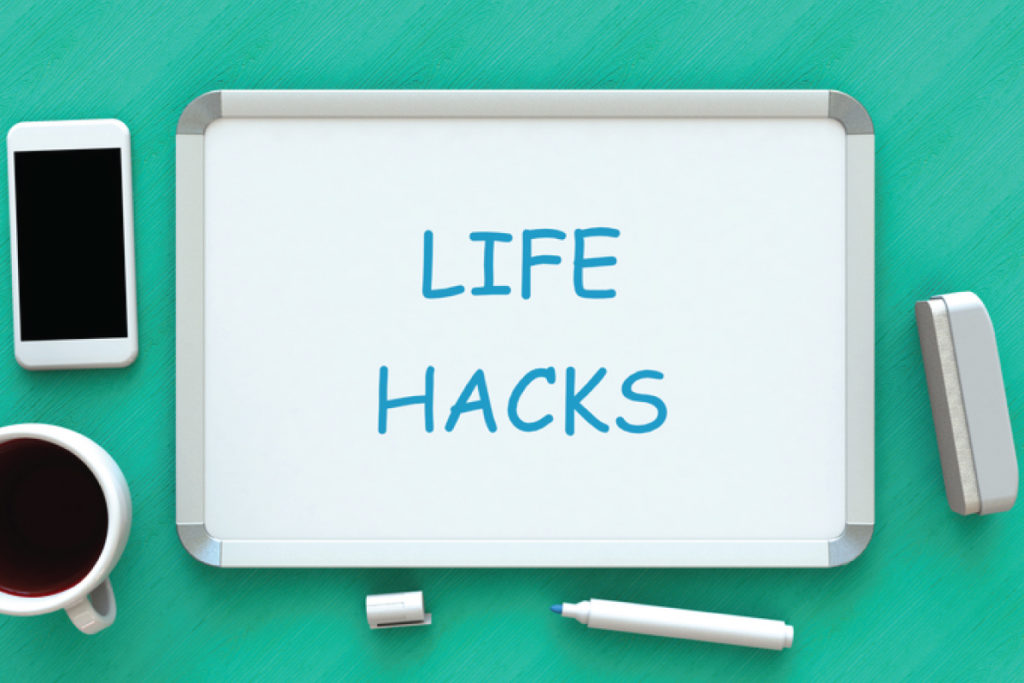 dry erase board with the words Life Hacks written on it