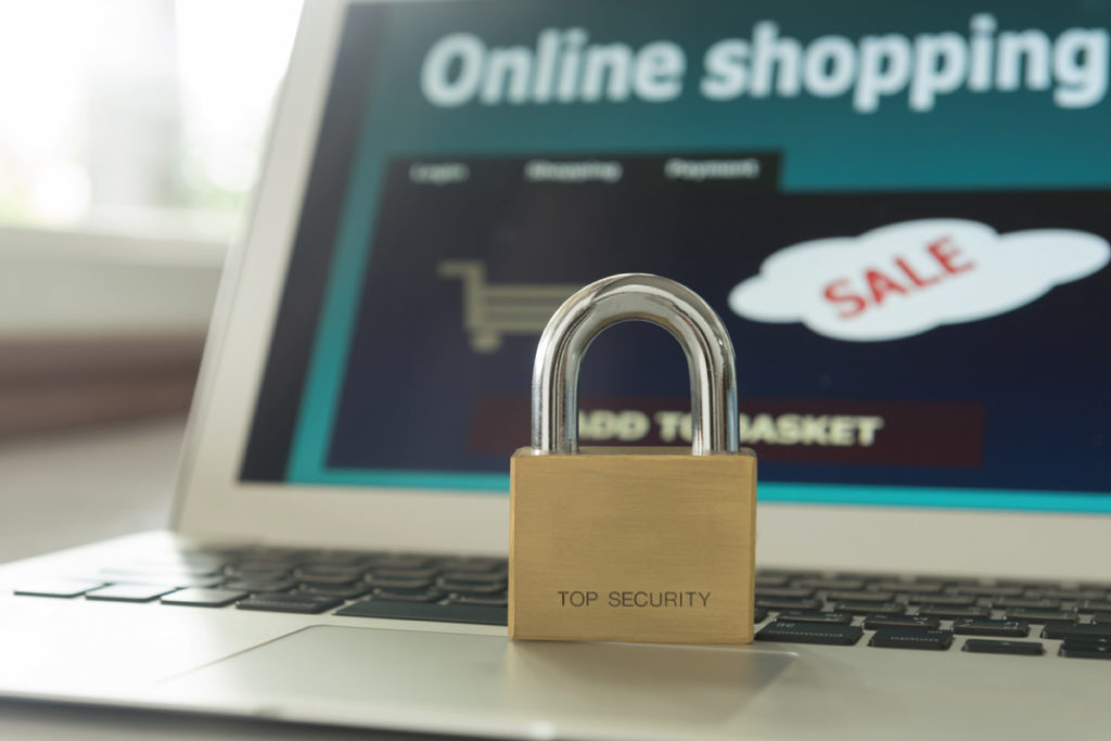 security lock on a laptop computer guarding from online shopping