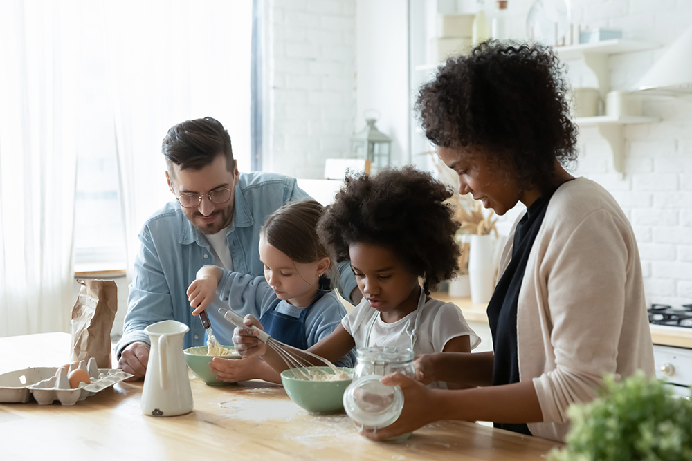 family in the kitchen cooking together