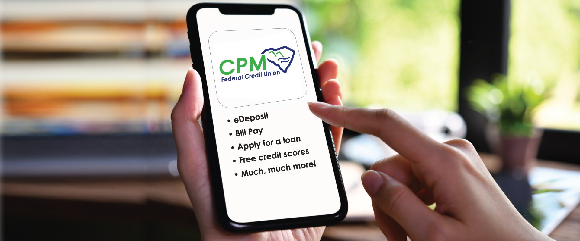 hand holding a cell phone with the cpm app on the screen