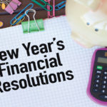 The words: new years financial resolutions written on a piece of paper with a calculator and a piggy bank