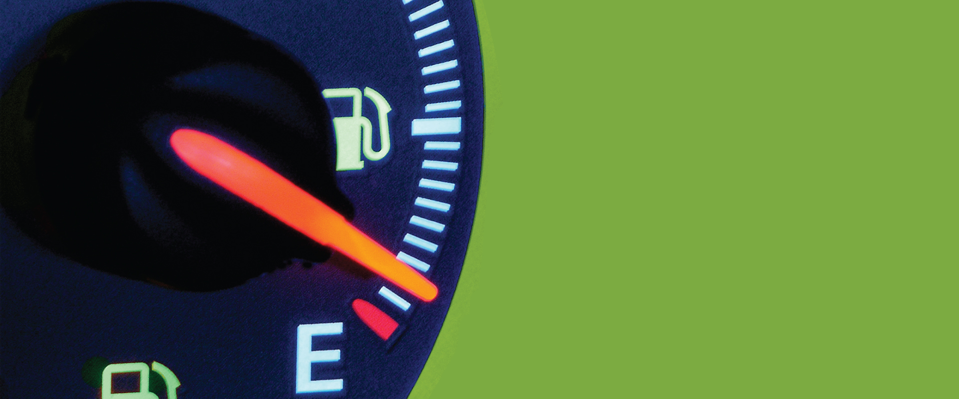 picture of an car gas guage with the needle pointing to empty