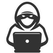 masked figure on a laptop committing fraud